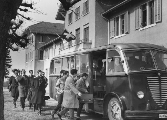 people entering a bus