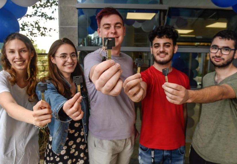 students holding keys